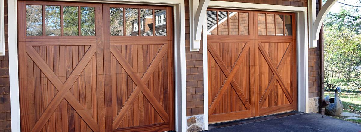 Wood Carriage house style garage doors Charles River series Lancaster model with square glass by Everite